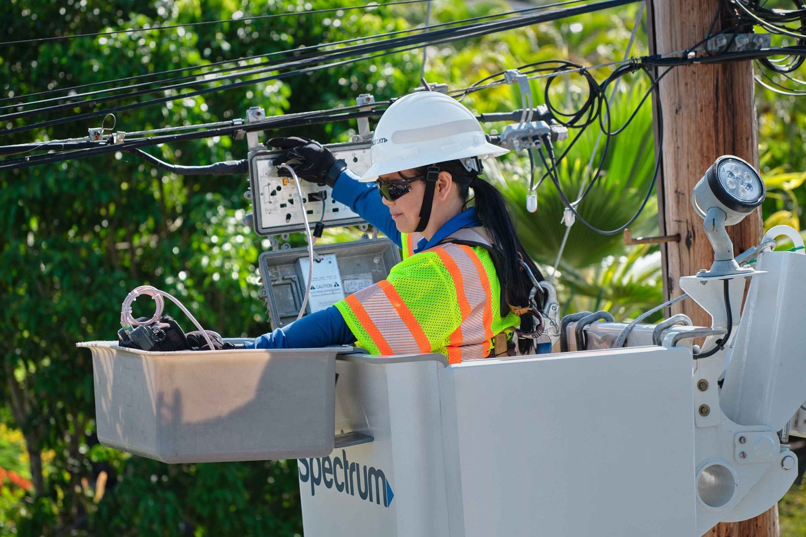 spectrum worker doing work on main line